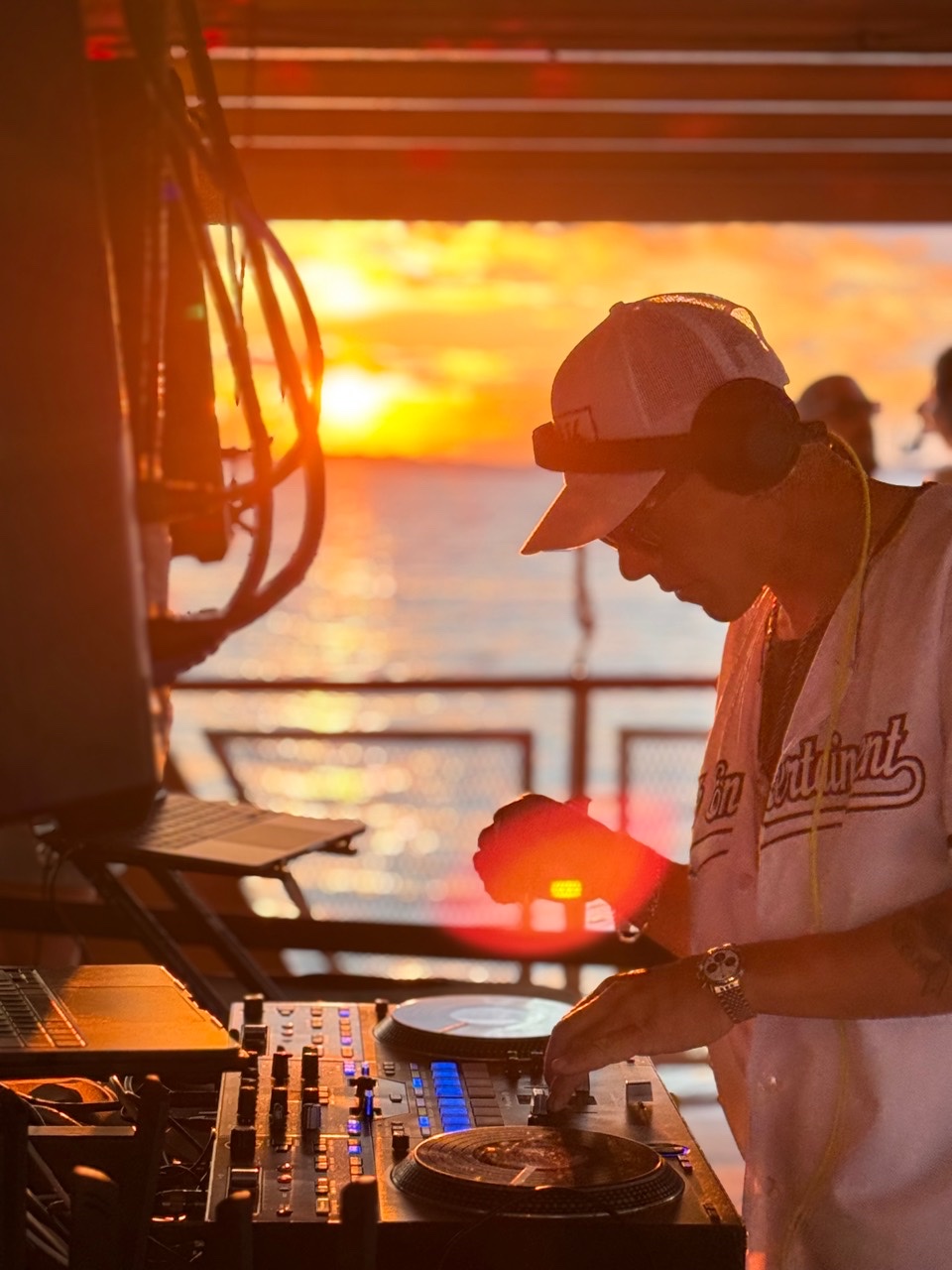 DJ Milk performing during a Cape Cod sunset boat cruise