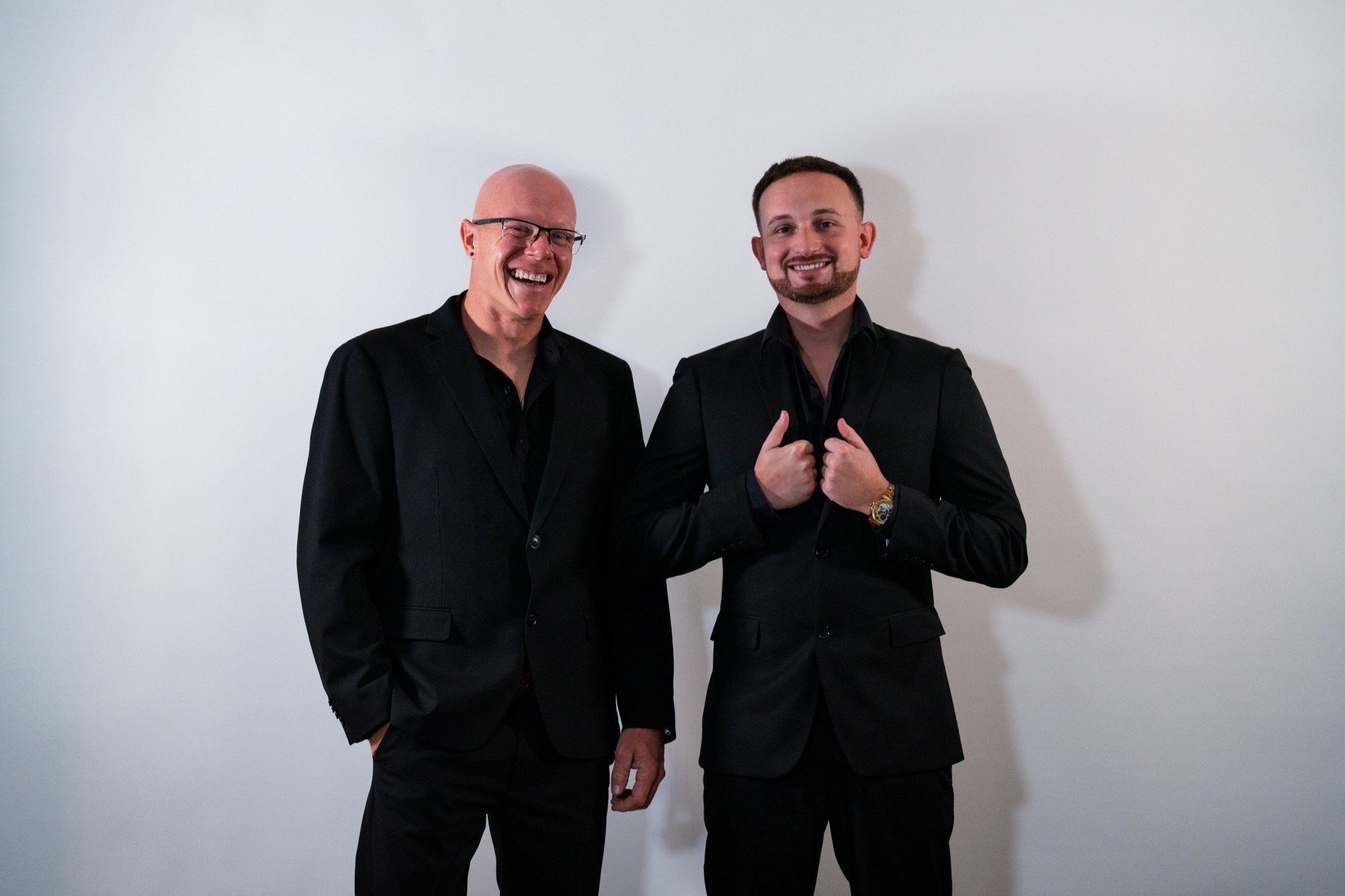 Milk Entertainment team members in formal event attire
